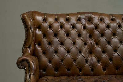 Highly Original Tufted English Wingback Settee in Patinated Leather 1900