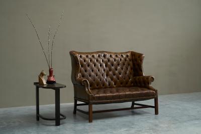 Highly Original Tufted English Wingback Settee in Patinated Leather 1900