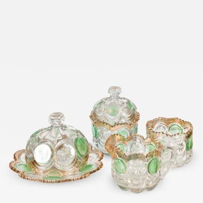 Highly decorative Continental cut glass table set detailed in green and gold