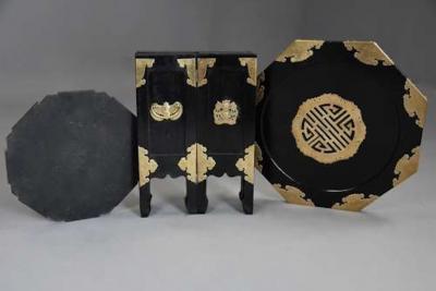 Highly decorative Oriental ebonised brass octagonal table