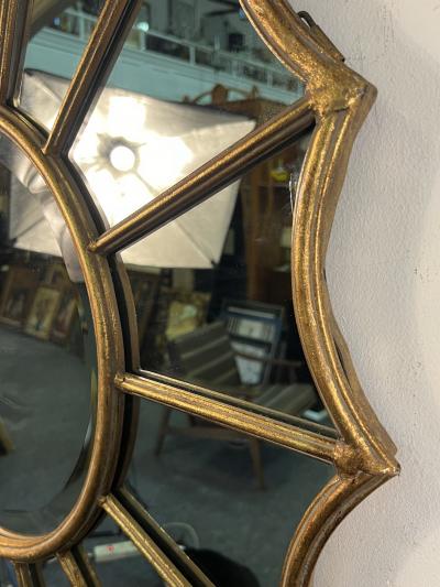 ITALIAN GILDED RESIN AND METAL FRAMED STARBURST MIRROR
