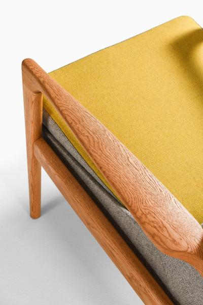 Ib Kofod Larsen Pair of Easy Chairs in Brass Oak and Wool by Ib Kofod Larsen 1950s