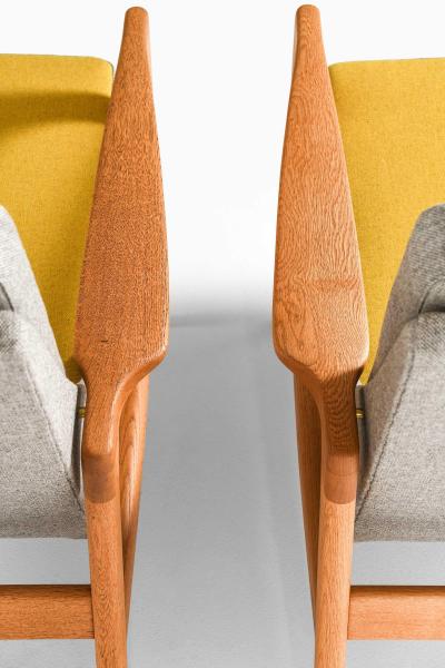 Ib Kofod Larsen Pair of Easy Chairs in Brass Oak and Wool by Ib Kofod Larsen 1950s