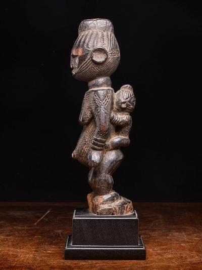 Igala scarified Maternity with infant on her back Nigeria