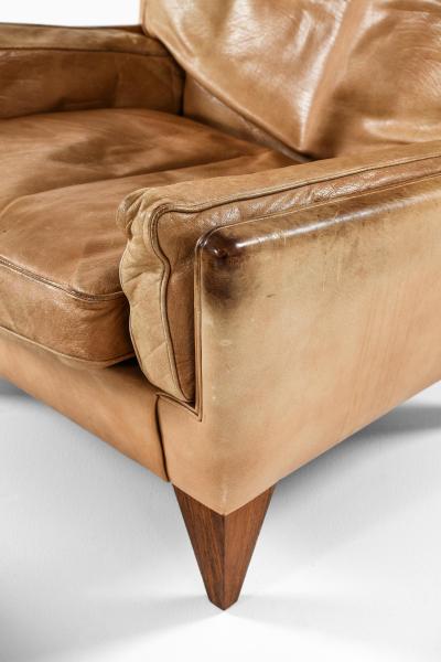 Illum Wikkels Easy Chair in Leather and Rosewood with Stool by Illum Wikkels 1960s