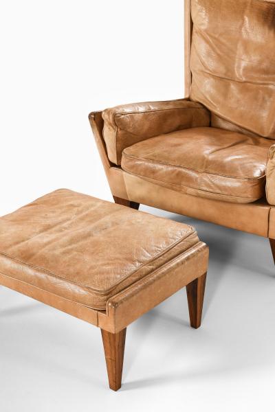 Illum Wikkels Easy Chair in Leather and Rosewood with Stool by Illum Wikkels 1960s