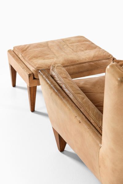 Illum Wikkels Easy Chair in Leather and Rosewood with Stool by Illum Wikkels 1960s