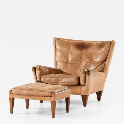 Illum Wikkels Easy Chair in Leather and Rosewood with Stool by Illum Wikkels 1960s