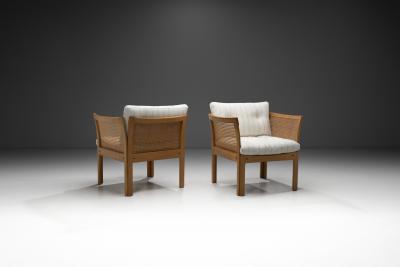 Illum Wikkelso Pair of Plexus Oak and Cane Easy Chairs by Illum Wikkels Denmark circa 1970s