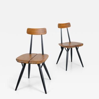 Ilmari Tapiovaara Pair of Ilmari Tapiovaara Pirkka chairs Laukaan Puu Finland 1950s