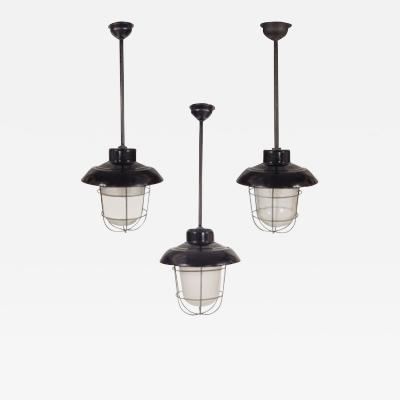 Industrial black enamel cage and glass globe lights 