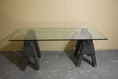 Industrial sawhorses and glass coffee table