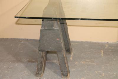Industrial sawhorses and glass coffee table