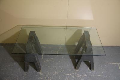 Industrial sawhorses and glass coffee table