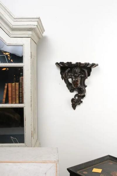 Italian Baroque Style Late 19th Century Fruitwood Wall Bracket with Carved Putto