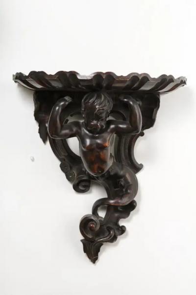 Italian Baroque Style Late 19th Century Fruitwood Wall Bracket with Carved Putto