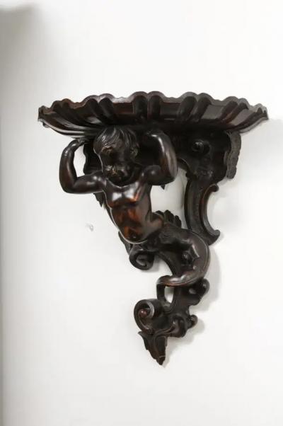 Italian Baroque Style Late 19th Century Fruitwood Wall Bracket with Carved Putto