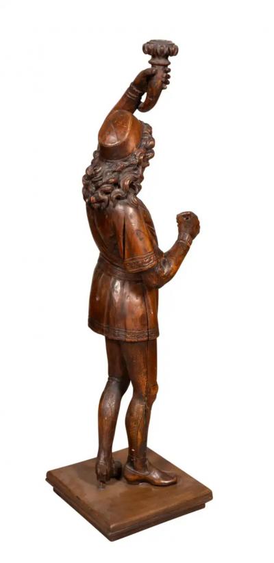 Italian Carved Walnut Torchere Of A Standing Boy Holding A Torch