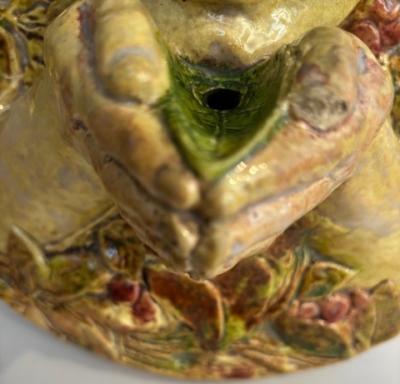 Italian Majolica porcelain round wall plaque with a cupid hold hands in front of