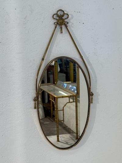 Italian Neoclassical Oval Mirror with Brass Ribbon and Tassel Detailing 1950s