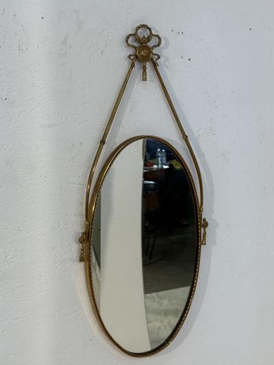 Italian Neoclassical Oval Mirror with Brass Ribbon and Tassel Detailing 1950s