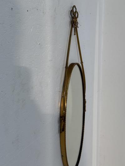 Italian Neoclassical Oval Mirror with Brass Ribbon and Tassel Detailing 1950s