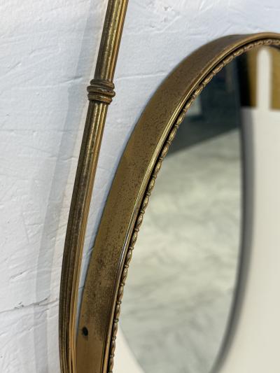 Italian Neoclassical Oval Mirror with Brass Ribbon and Tassel Detailing 1950s