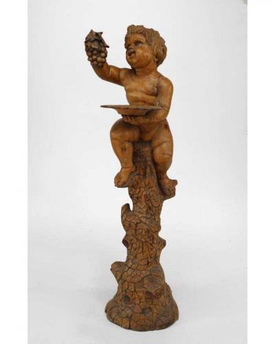 Italian Renaissance style stripped pedestal with cupid holding grapes