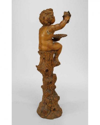 Italian Renaissance style stripped pedestal with cupid holding grapes