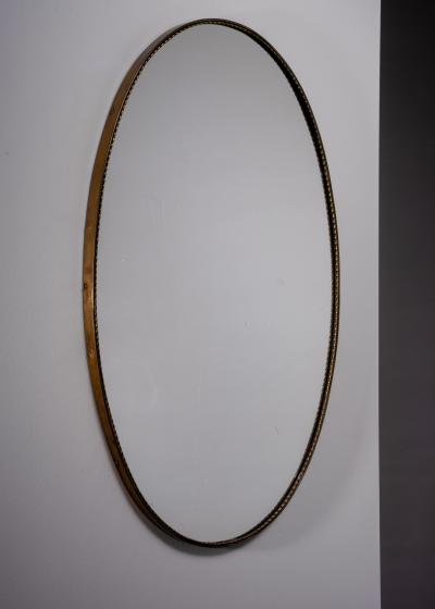 Italian oval brass mirror with beaded decoration