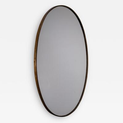Italian oval brass mirror with beaded decoration