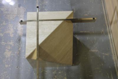 Italian travertine coffee table with brass supports and glass top