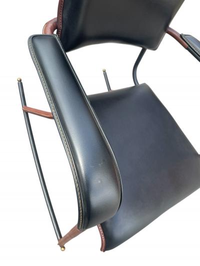Jacques Adnet 1950s Stitched leather and m tal rocking chair by Jacques Adnet