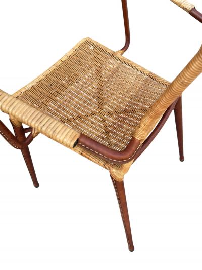 Jacques Adnet 1950s Stitched leather and rattan armchairs by Jacques ADNET