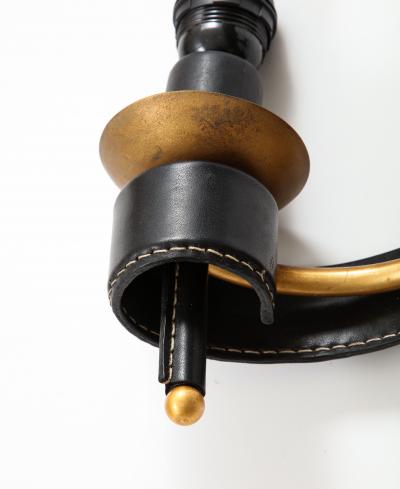 Jacques Adnet A Pair of Double Arm Sconces in Brass and Black Leather