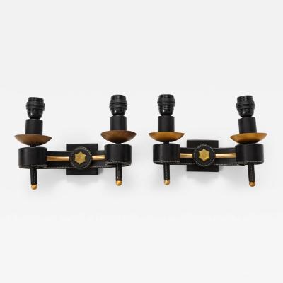 Jacques Adnet A Pair of Double Arm Sconces in Brass and Black Leather