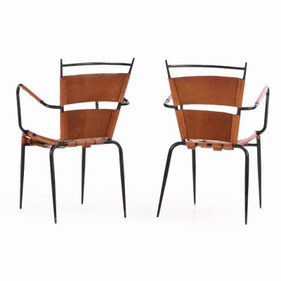 Jacques Adnet A Pair of French iron leather armchairs in manner of Jacques Adnet C 1950 
