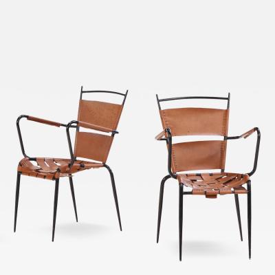 Jacques Adnet A Pair of French iron leather armchairs in manner of Jacques Adnet C 1950 