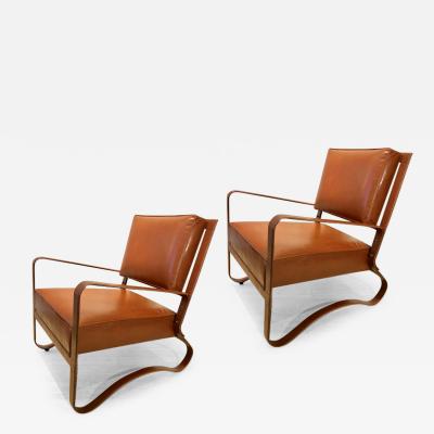 Jacques Adnet Jacques Adnet pair of brown hand stitched leather lounge chairs