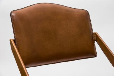 Jacques Adnet Pair Of Stitched Leather Armchairs By Jacques Adnet