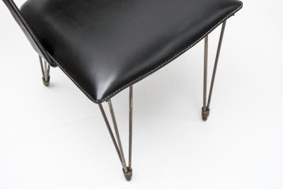 Jacques Adnet Pair oStitched Leather armchairs by Jacques Adnet