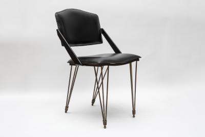 Jacques Adnet Pair oStitched Leather armchairs by Jacques Adnet