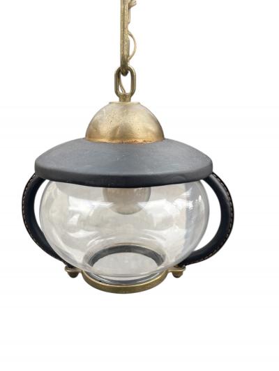 Jacques Adnet Pair of 1950s Stitched leather lanterns by Jacques Adnet