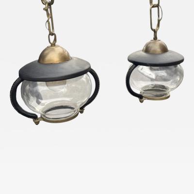 Jacques Adnet Pair of 1950s Stitched leather lanterns by Jacques Adnet