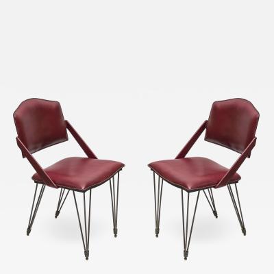 Jacques Adnet Pair of Stitched Leather armchairs By Jacques Adnet