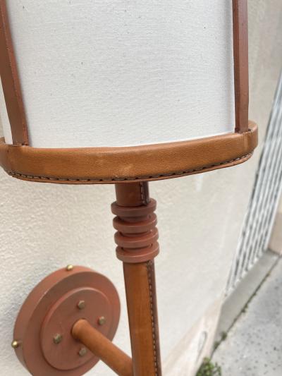 Jacques Adnet Pair of tall stitched leather lantern sconces by Jacques Adnet