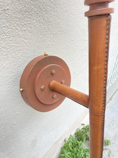 Jacques Adnet Pair of tall stitched leather lantern sconces by Jacques Adnet