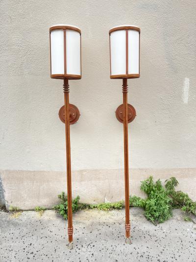 Jacques Adnet Pair of tall stitched leather lantern sconces by Jacques Adnet