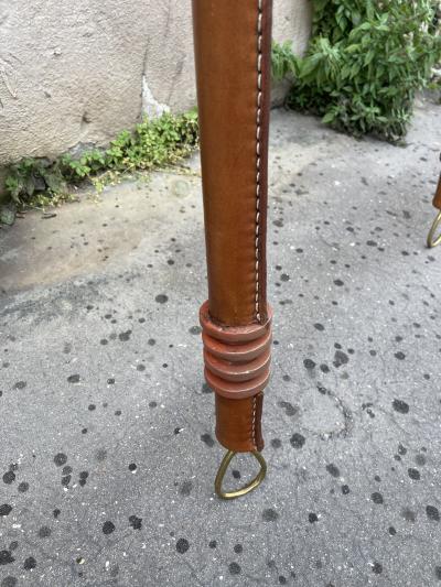 Jacques Adnet Pair of tall stitched leather lantern sconces by Jacques Adnet