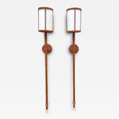 Jacques Adnet Pair of tall stitched leather lantern sconces by Jacques Adnet